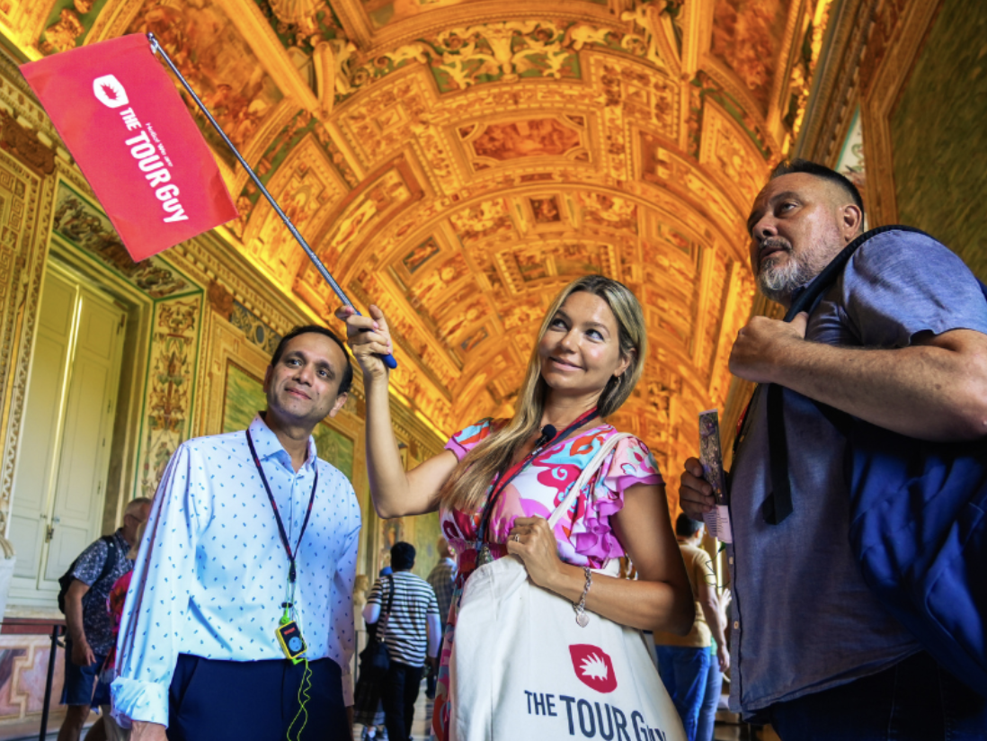 A small group is visiting the Vatican after hours.